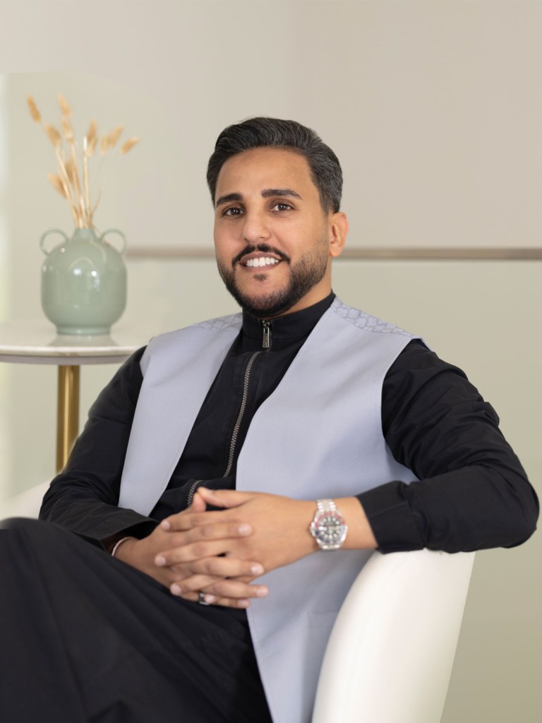 Dr. Mazin Bafaraj, Medical Director and Consultant in Dermatology, Laser, and Cosmetic Treatments, seated in a professional setting.